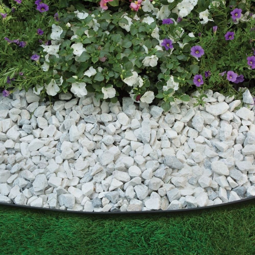 Flexible plastic edging around a garden bed